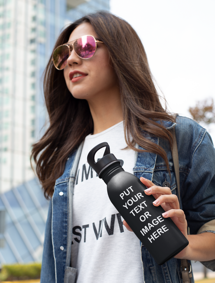 Woman holding a black Your Text Or Image Here water bottle.