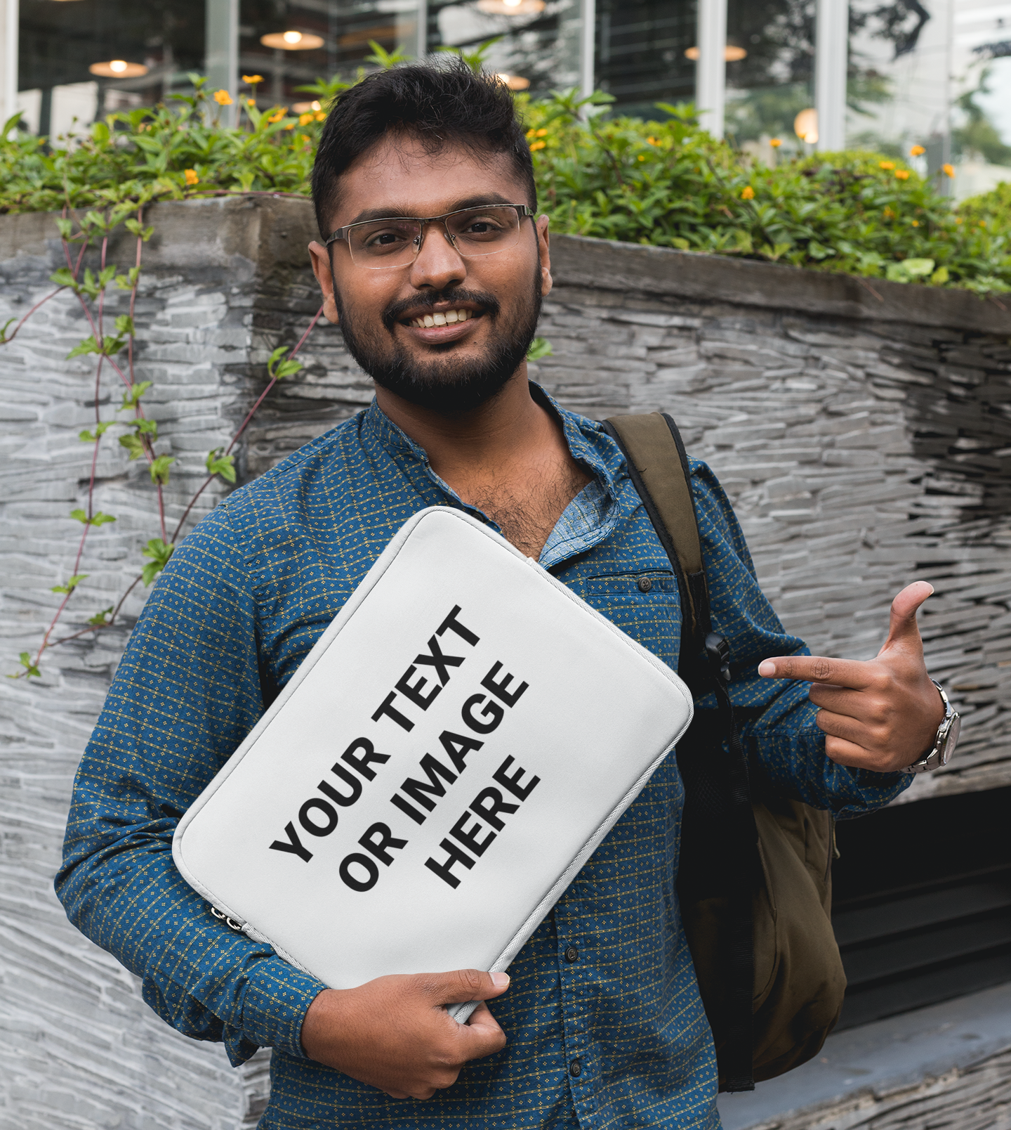 A man holding a laptop sleeve that reads: Your Text Or Image Here.