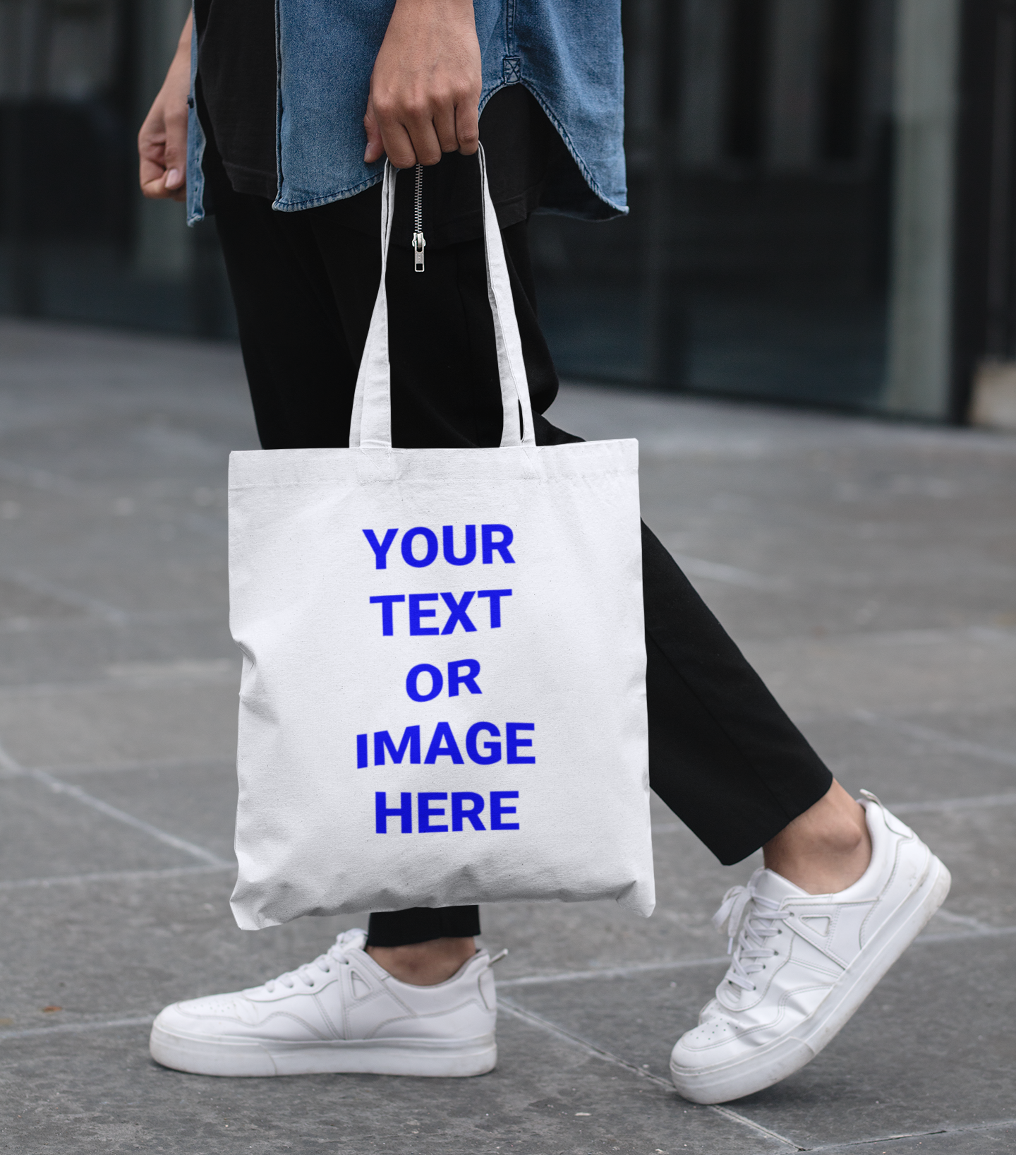 A man walking with a bag that reads: Your Text Or Image Here.