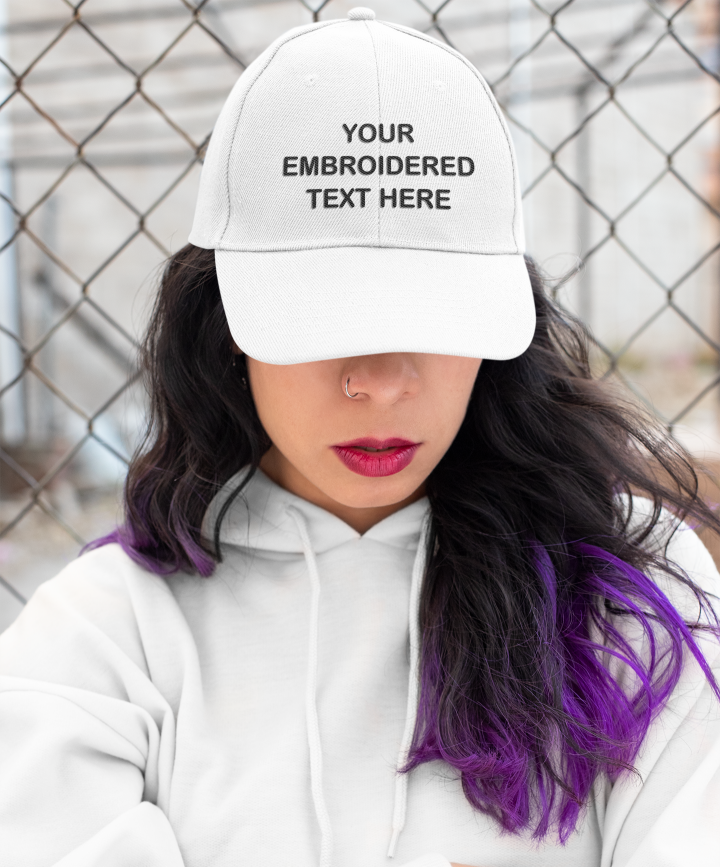 Woman wearing a white Your Embroidered Text Here cap.