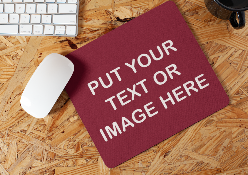 Red Your Text Or Image Here mousepad on a wood desk.